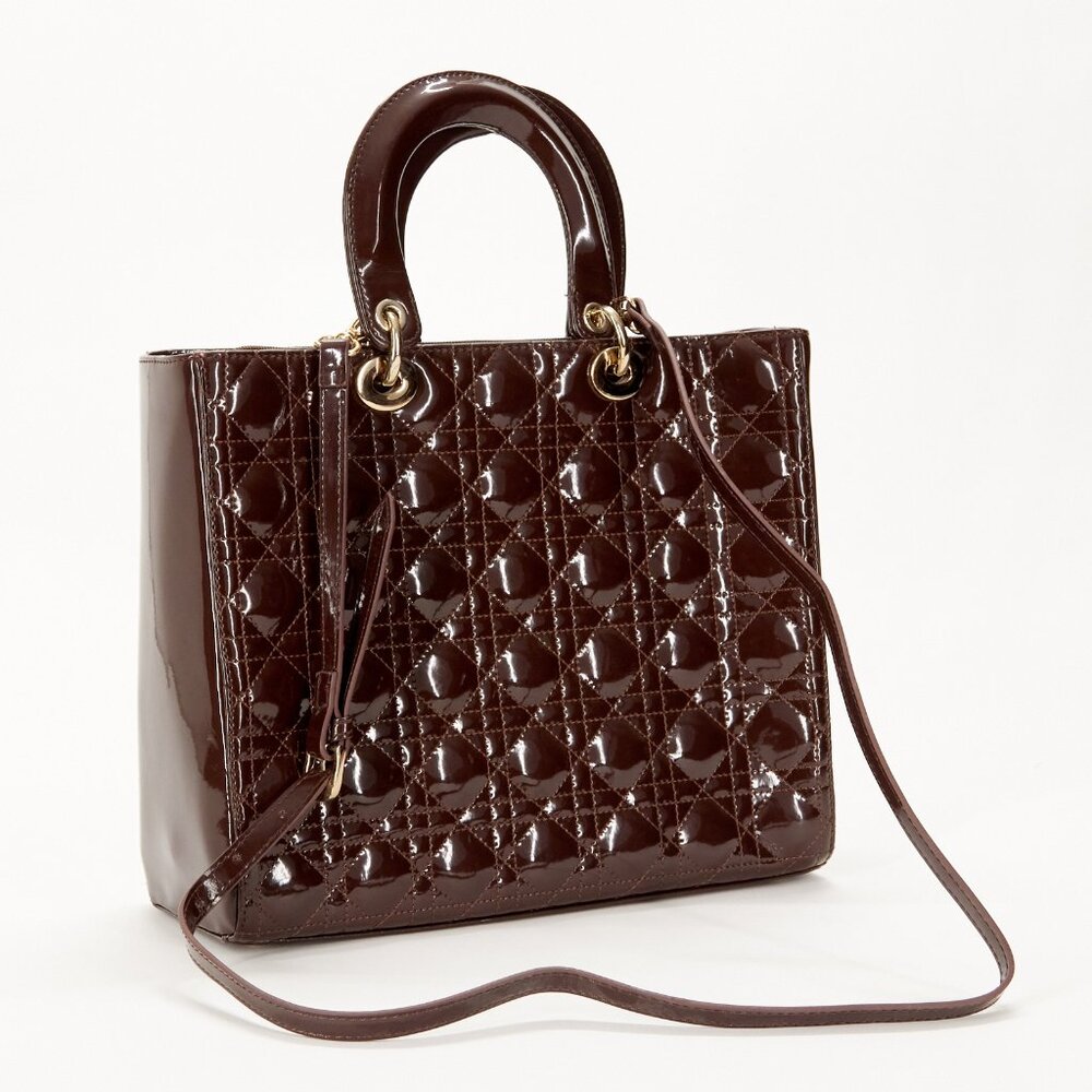 Brown sophisticated patent leather bag.